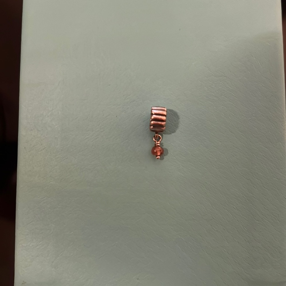 Pandora RETIRED sterling silver circle with a dangling light pink gem